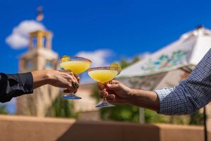 Cheers, sunny outdoor celebration.