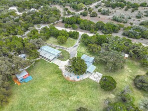 Aerial view of the property showing the four individual units in relation to each other and amenities