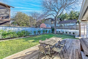 Spacious deck with grill and outdoor seating 