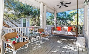 Covered balcony with comfy seating
