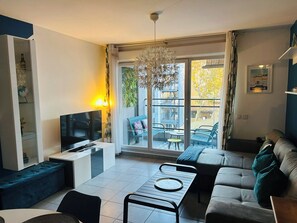 Living room, TV, sofa, coffee table, terrace