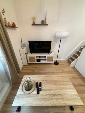 TV, table , staircaise