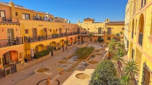 Enjoy the view of the courtyard from the balcony now planted with orange trees. 