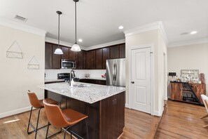 Fully stocked kitchen with large island and coffee bar