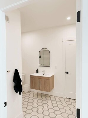 Bright and fresh bathroom with shower.
