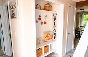 Mud room area has umbrellas and even pickle ball paddles!