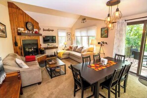 Main floor features living room with a fireplace! Wood is provided. 