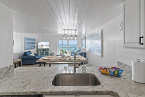 Cook delicious meals in the REMODELED Kitchen while overlooking the Gulf of Mexico