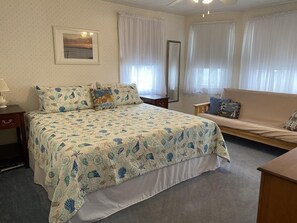 Spacious bedroom with a king-sized bed, perfect for unwinding after a day of exploring Cape May.