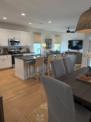 Open floor plan kitchen, dining, den