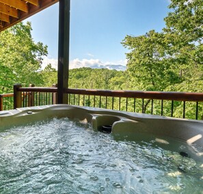 Enjoy the amazing views from the private outdoor hot tub.