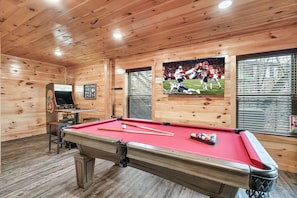 Enjoy a room full of fun activities! Pool table, arcade, table games, and TV.