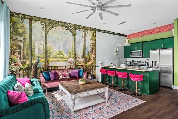Insta-worthy main lounge with a unique wallpaper and decor that is sure to WOW! Comfortable seating for your entire group!