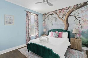 A gorgeous floral themed bedroom with unique design elements 