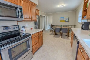 Bright modern kitchen equipped with all of the essentials you need