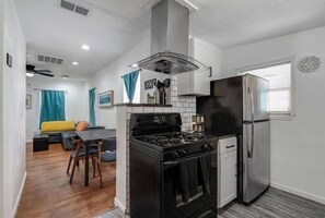 Newly added Kitchen exhaust fan. Full size stove and refrigerator