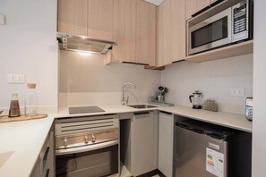 Experience a sleek and modern kitchen equipped with stainless steel appliances, perfect for preparing meals during your stay.
