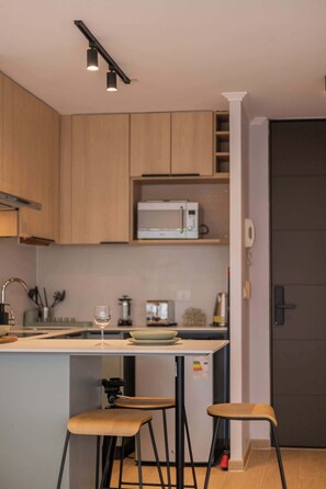 Enjoy a stylish and functional kitchen equipped with modern amenities, perfect for preparing meals during your stay.