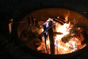 Bring back the simple joys of cabin life—roasting hot dogs over an open flame and sharing laughs under the stars.