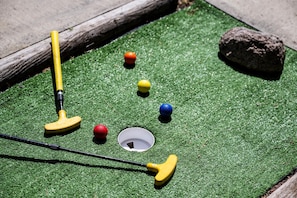 Colorful golf balls and kid-sized putters make this spot a hit for families and casual players alike.