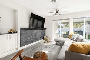 "Gather the gang for a comfy movie marathon in our inviting living room."