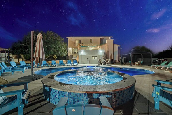 Beneath the twinkling stars, the pool’s glow beckons you to relax and let the night embrace you. Immerse yourself in tranquility where the water mirrors the cosmos, creating a serene escape from the everyday hustle.
