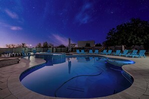 Under a starry sky, the glowing pool invites you to relax and unwind. Perfect for a peaceful night of stargazing and serenity. 🌌🏊‍♂️✨