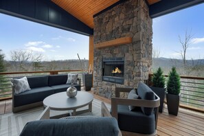 Blue Fox - Entry Level Outdoor Sitting Area With Wood Burning Fireplace