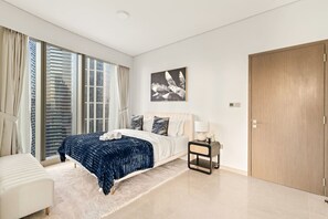 Elegant Bedroom: Chic decor meets skyline views—your urban oasis awaits in Dubai!