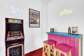 Mini bar and arcade game in the game room