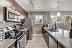 Spend quality time together in this well-equipped space! Enjoy preparing meals in the modern kitchen, relaxing in comfortable living areas, and creating lasting memories during your stay.