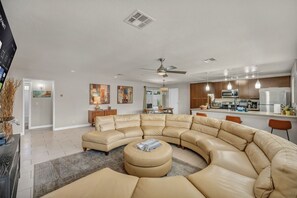 Book this property for shared comfort and togetherness! Enjoy relaxing on the spacious sectional, perfect for everyone to unwind. Create lasting memories in a welcoming and open living space.