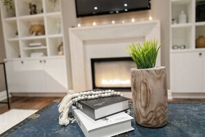 Artfully styled with books and decor, sets the tone for a stylish and sophisticated stay.