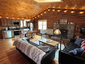 Open plan living / dining area with fireplace