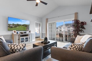 Cozy up and catch your favorites in this inviting living space.
