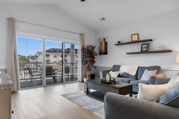 Cozy up and catch your favorites in this stylish living room retreat.