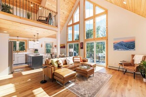 Main living area with cathedral natural pine ceilings