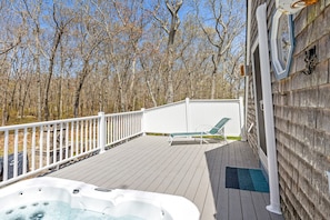 Hot tub overlooking the backyard.