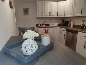 Our beautiful eat in kitchen will seat up to four (4)