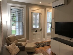 Exterior entrance door surrounded by windows