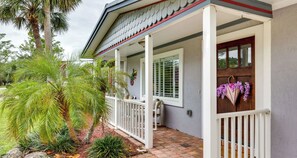 Charming Front Porch with Lush Tropical Landscaping - Perfect Spot to Relax!