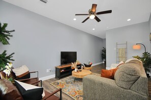 Living room with comfortable sleeper bed.