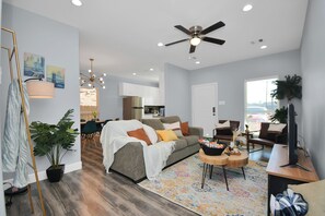 Living room with comfortable sleeper bed.