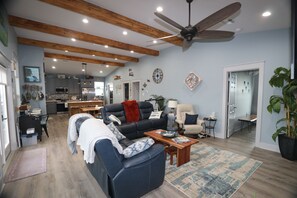 Nice sitting area with big screen tv. Ceiling fan.