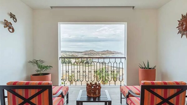 Ocean-view terrace with colorful seating at Vista Encantada Resort.