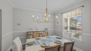 Coastal dinners, card games, or morning mimosas — the heart of the cottage is ready for memories.