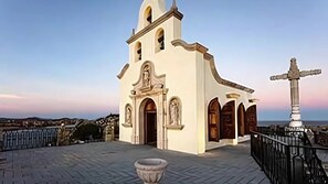 Romantic sunset chapel views at Vista Encantada in Cabo San Lucas.