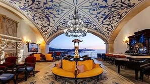 Vista Encantada lounge with ornate ceilings and panoramic views.