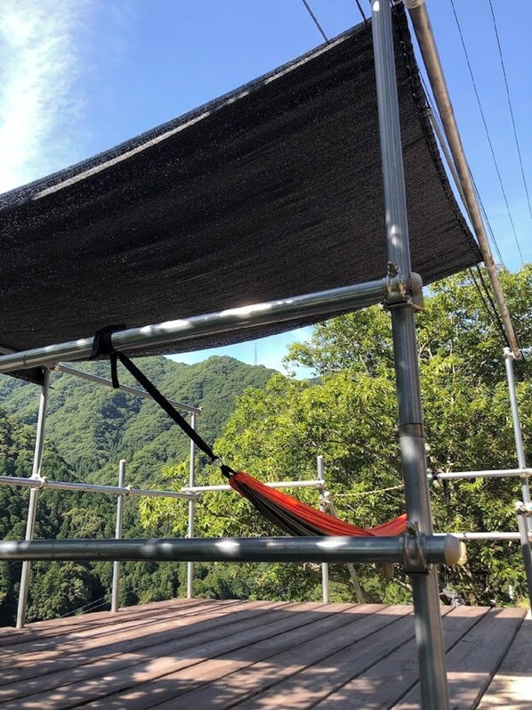 1. Terrace. If the weather is nice, you can use the outdoor hammocks.