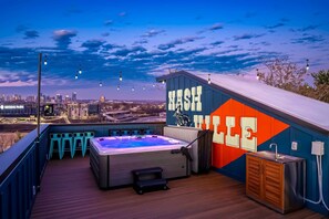 Experience Nashville from this stunning rooftop retreat! Enjoy skyline views and unwind in your private hot tub—perfect for bachelorette parties or family reunions. Your luxurious getaway in Music City awaits!